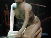 Ushabti statue of a woman kneading bread, found at a tomb in Saqqarah, now in the Alexandria National Museum, Egypt.