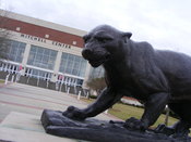 English: The Jaguar statue and the Mitchell Center Arena.