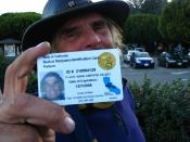 English: Man holding a California state-issued card authorizing him to obtain medical cannabis