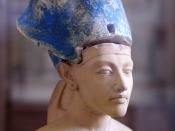 Small statue of Ahkenaten wearing the blue crown