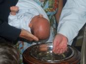 English: A child is baptized in a lutheran church of Brazil.