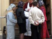 English: A Russian Orthodox priest, parents, godparents and a baptized baby