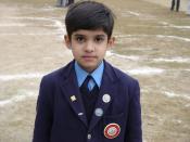 A young Pakistani student in his school uniform.
