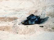 English: An Iraqi T-54A or Type 59 tank lies in ruins in the aftermath of an Allied bombing attack during Operation Desert Storm.