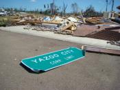English: The town sign for Yazoo City, Mississippi, along with the ruins of a large brick building. The damage was caused by an April 24, 2010 tornado which killed 10 people in Mississippi.
