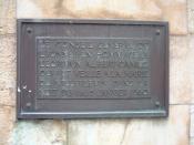 The bronze plaque on the monument to Camus in the town of Villeblevin, France. The plaque reads: 