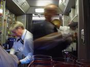 English: Busy Lufthansa flight-attendants in kitchen
