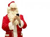 Santa Claus tapping a smart phone