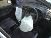 The driver and passenger front airbags, after having been deployed, in a Peugeot 306 car.