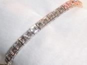 A classic in line bracelet by Trifari. This style become known as a tennis bracelet.