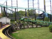 A scene from Kennywood, an amusement park located in West Mifflin, Pennsylvania on the Monongahela River. This is a view from the station of the Phantom's Revenge looking toward the Turtle (Kennywood). Part of the track of the Thunderbolt is visible as we