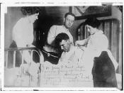 Dr. James F. Grant, ship's surgeon, fixing up Gordon G. Davidson, survivor of EMPRESS OF IRELAND, in Hotel Frontenac at Quebec  (LOC)