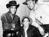 Publicity photo from the television program The Rifleman. Pictured from left: Sammy Davis, Jr., Johnny Crawford, and Chuck Connors.
