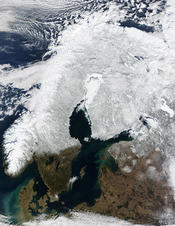 English: Snow Cover Across Scandinavia. In this mostly cloud-free true-color scene, much of Scandinavia can be seen to be still covered by snow. From left to right across the top of this image are the countries of Norway, Sweden, Finland, and northwestern