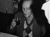 William Burroughs enjoying cake and alcohol at his 70th birthday.