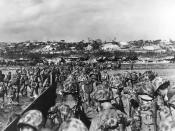 U.S. Marine reinforcements wade ashore to support the beachhead on Okinawa, 31 March 1945.