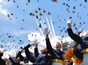 English: Cadets of the Air Force Academy Class of 2003 celebrate at graduation ceremonies on May 28, 2003 as the Air Force Thunderbirds fly overhead. The 974 students marked the academy's 45th graduating class.