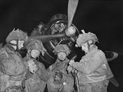 British Pathfinders synchronising their watches in front of an Armstrong Whitworth Albemarle.