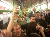 English: Revellers enjoying the last chance to drink alcohol on the London Underground.