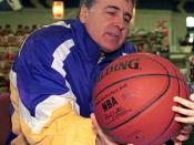 Cropped version of Ryan Caron (not shown), a five-year old dependant at Royal Air Force (RAF), Lakenheath, UK gets National Basketball Association (NBA) Hall-of-Famer Gail Goodrich to autograph his basketball. Mr. Goodrich is part of the 3RD Annual Hardco