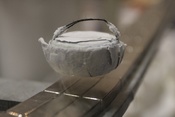 A high-temperature (liquid nitrogen cooled) superconductor levitating above a permanent magnet (TU Dresden)