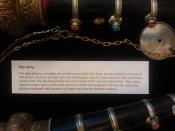 Rgya gling: The rgya gling is a wood oboe with a metal alloy bell, head, and mouthpiece. A series of link chains run from the bell up to the mouthpiece, which is encircled by a disc and holds a double reed. Tibetan Buddhist rituals and religious music.