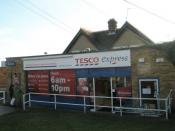 English: Tesco Express at Farlington In its various identities(Dillons, Fourboys, One-Stop) it has always done well -the only shop serving a large residential area.