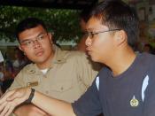 US Navy 070719-N-0120A-057 Dock landing ship USS Harpers Ferry (LSD 49) Sailor talks to a Singapore navy sailor during a community interaction project at a Movement for the Intellectually Disabled of Singapore (MINDS) training