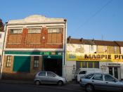 English: Service Industry, Magpie Hall Rd An asian food distributor (in a building built in 1925) & a car repair garage