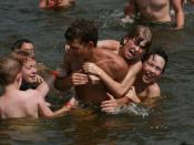 Kids playing in a lake at a church camp