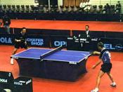 A competitive table tennis game.