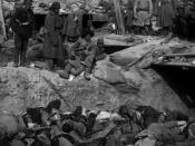 Russian soldiers looking down at a trench filled with corpses of Japanese soldiers, Port Arthur