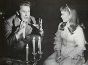 A screenshot of Kirk Douglas and Jane Wyman in The Glass Menagerie