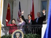 President George W. Bush, Chinese President Hu Jintao, Laura Bush and Hu's wife, Liu Yongqing, wave from the South Portico balcony after the South Lawn Arrival Ceremony at the White House,