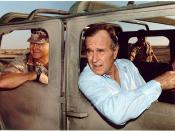 (George H.W. Bush riding in a Humvee with General Schwarzkopf in Saudi Arabia, November 22, 1990)