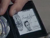 Columbo's warrant card and badge with the name Frank Columbo in the episode 