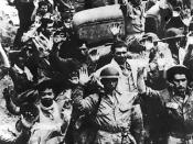 U.S. and Filipino forces surrender to the Japanese Army at Bataan