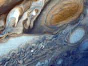English: Detail of Jupiter's atmosphere, as imaged by Voyager 1. Suggested for English Wikipedia:alternative text for images: view of Jupiter's clouds with the Great Red Spot at top right as brown oval to right of wavy white and brown clouds. Below the Gr