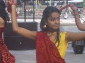 This picture was taken at the ImaginASIAN Night Market, which took place at Calgary's Olympic Plaza on Saturday, June 2, 2007. The girl was part of a group performing a folk dance from Gujarat, India.