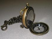 A pocket watch with an attached compass.