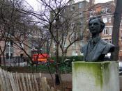 English: Bertrand Russell and Conway Hall Behind bust of Bertrand Russell (by Marcelle Quinton 1980) in Red Lion Square the entrance to Conway Hall can be seen with Royal Mail van parked outside.