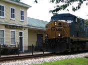 The Conyers Depot, now the Conyers Welcome Center, still sees trains running in front of it. Photo taken by Steve Karg