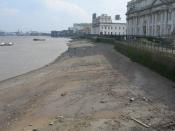 English: Low Tide at Greenwich Reach There are 2 men on the sand with metal detectors.