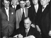 English: United States President signs the TVA Act, which established the . Senator George Norris is on the far right.