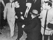 English: Lee Harvey Oswald being shot by Jack Ruby as Oswald is being moved by police, 1963