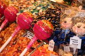 Giant Chupa Chups lollipops on display for sale on a market in Barcelona, Spain. Created by Michael Ströck (mstroeck) in May 2006. Released under the GFDL.