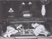 English: Photograph of two men reclining on couches at an opium house in China.