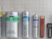 English: A side by side comparison of several batteries, with ruler and matchstick for scaling porpoises. In order the batteries are: 4.5 V (3R12) lantern D (R20) torch battery C (R14) torch battery AA (R6) torch battery AAA (R03) pencil battery AAAA (LR8