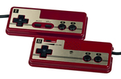 English: The pair of wired controllers that are attached to the Japanese Famicom video game console, made by Nintendo.