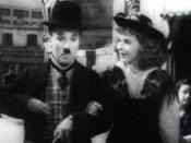 Cropped screenshot of Charlie Chaplin and Paulette Goddard from the film The Great Dictator